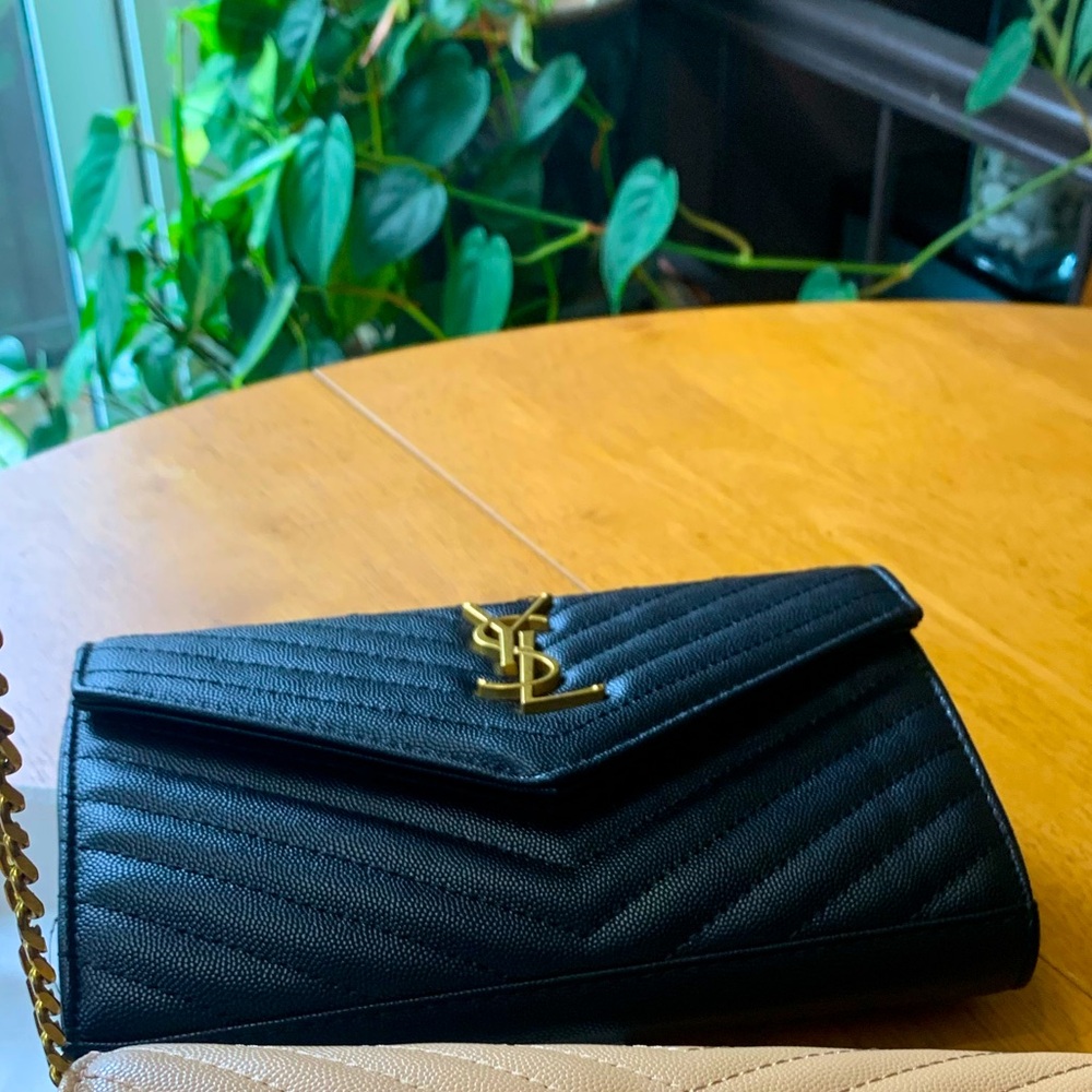 Cute black classy should bag or wristlet.